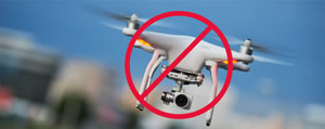 Temporary Flight Restricton (flying drone in a red circle with a line through it pictured) 